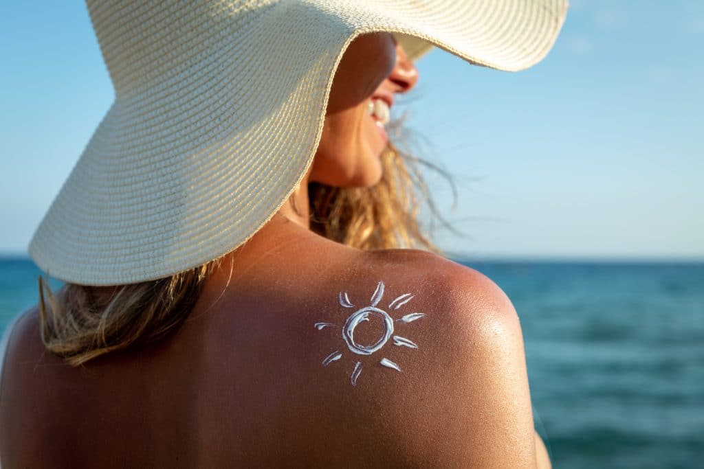 woman on beach | sun protection